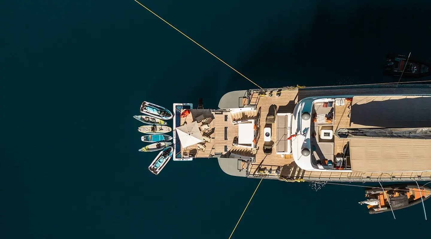 Aerial view of luxury motor yacht North Wind at sea, sunset glow, anchored