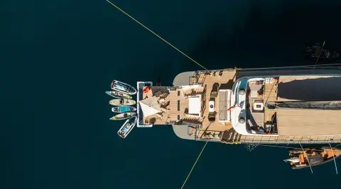 Aerial view of luxury motor yacht North Wind at sea, sunset glow, anchored