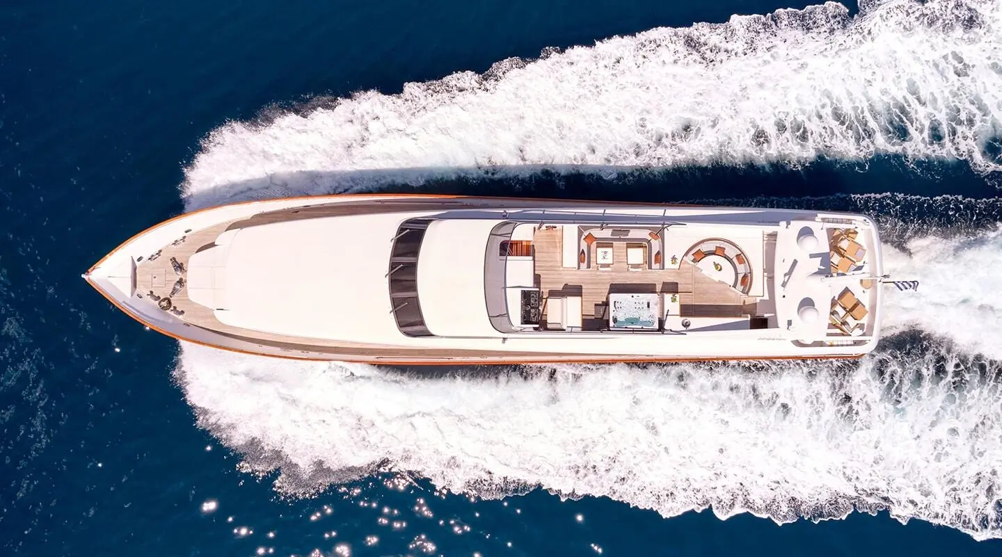 Top-down view of Mobius luxury motor yacht cutting through blue water