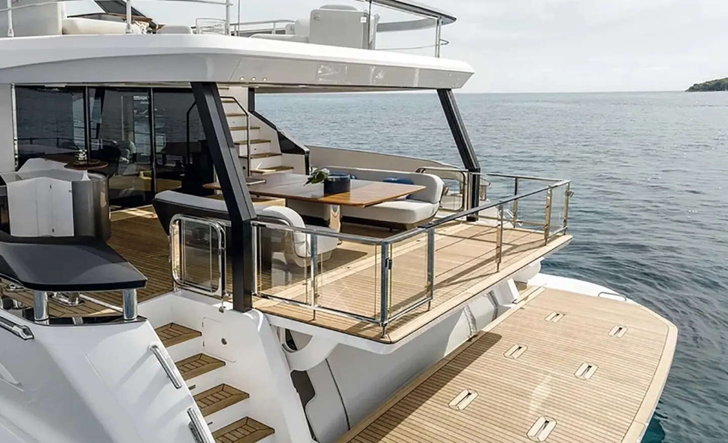 Viva II yacht deck seating area with cushioned loungers and ocean view