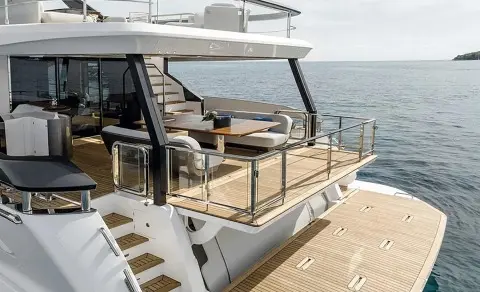 Viva II yacht deck seating area with cushioned loungers and ocean view
