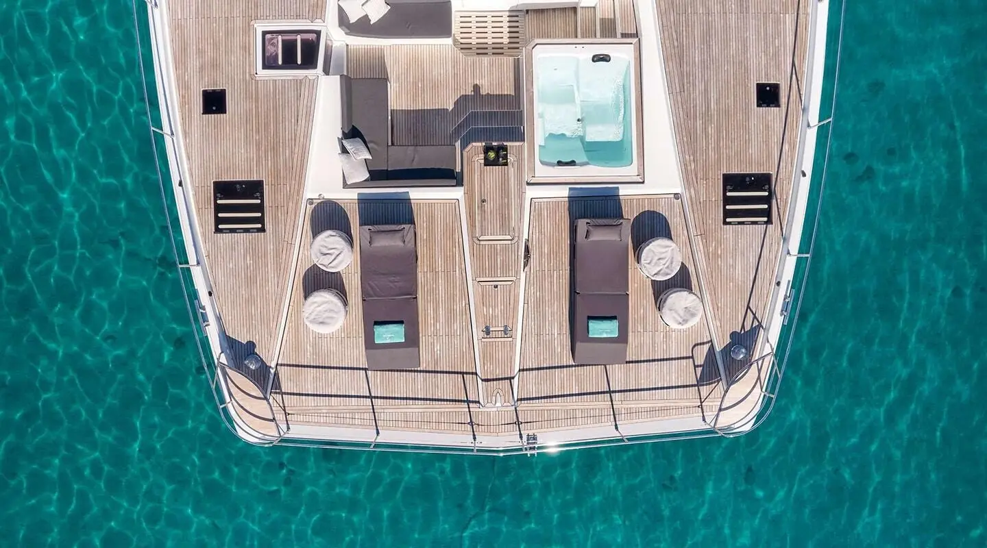 Aerial view of Christal Mio yacht at sea with upper deck lounge areas