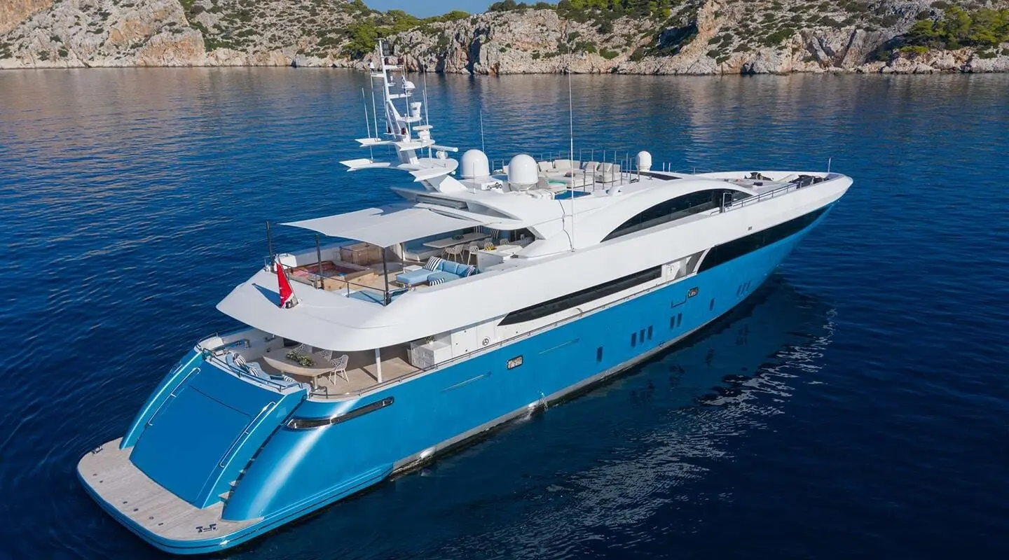 Sea Wolf yacht charter: sleek white motor yacht anchored in blue water
