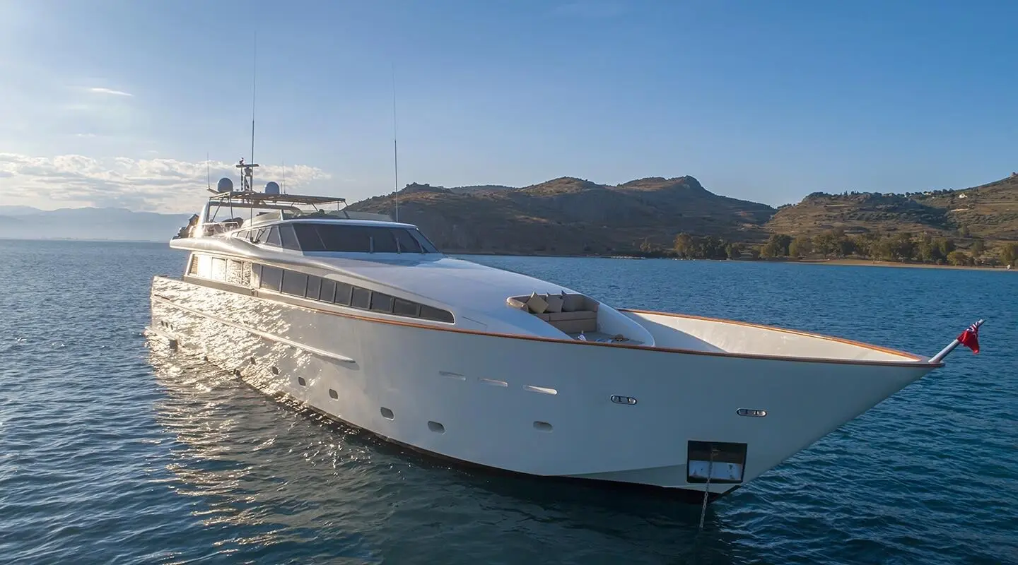 Aquila yacht anchored in open sea, white luxury motor yacht side profile