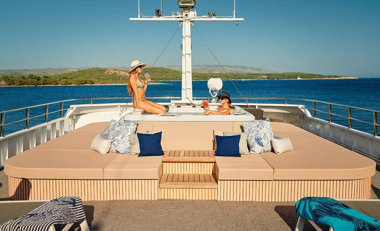 Lupus Mare motor yacht sun deck with people lounging and seating area