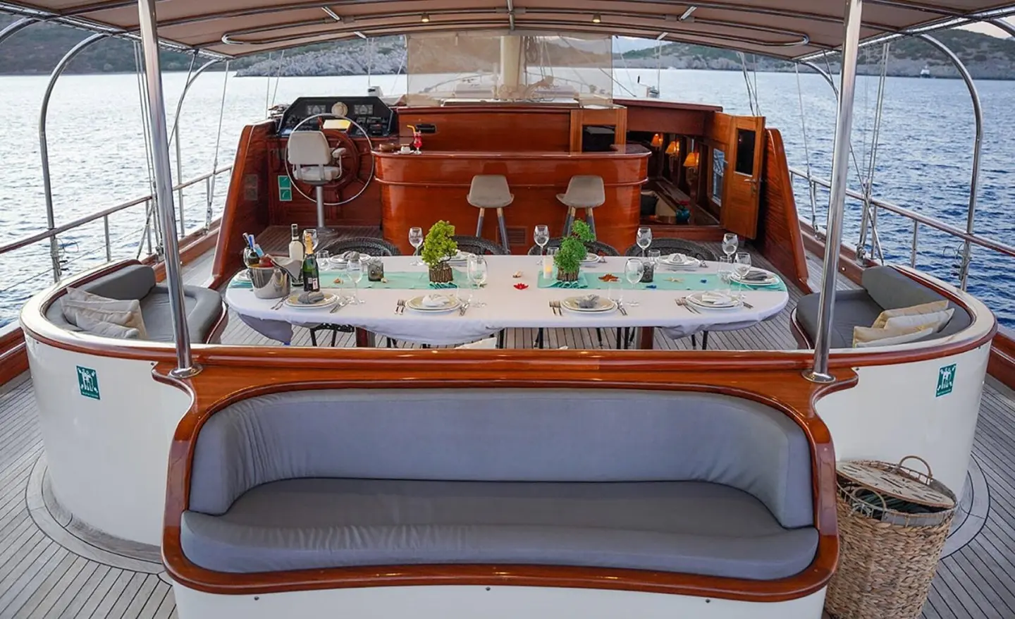 La Bella Vita yacht exterior aft deck dining area set for al fresco dinner