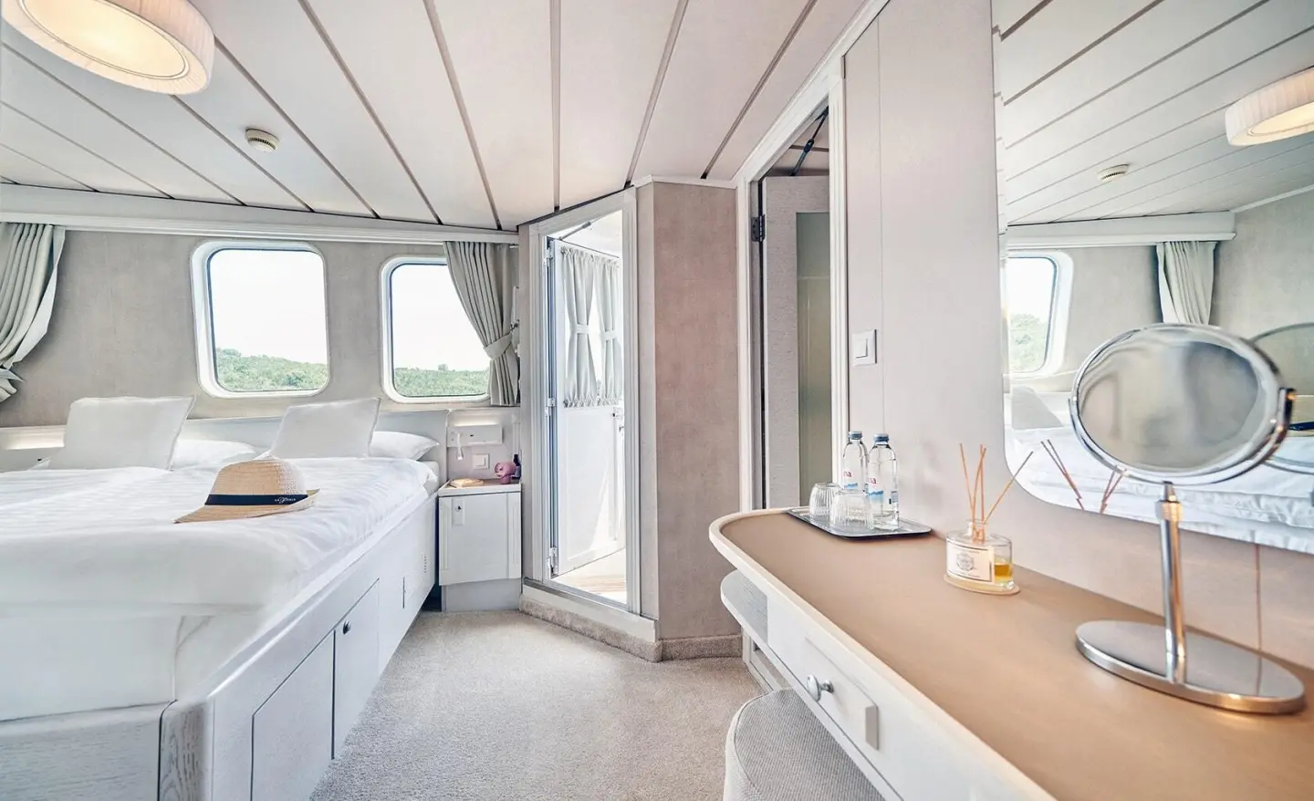 La Perla yacht interior with bright salon and sliding glass doors to deck