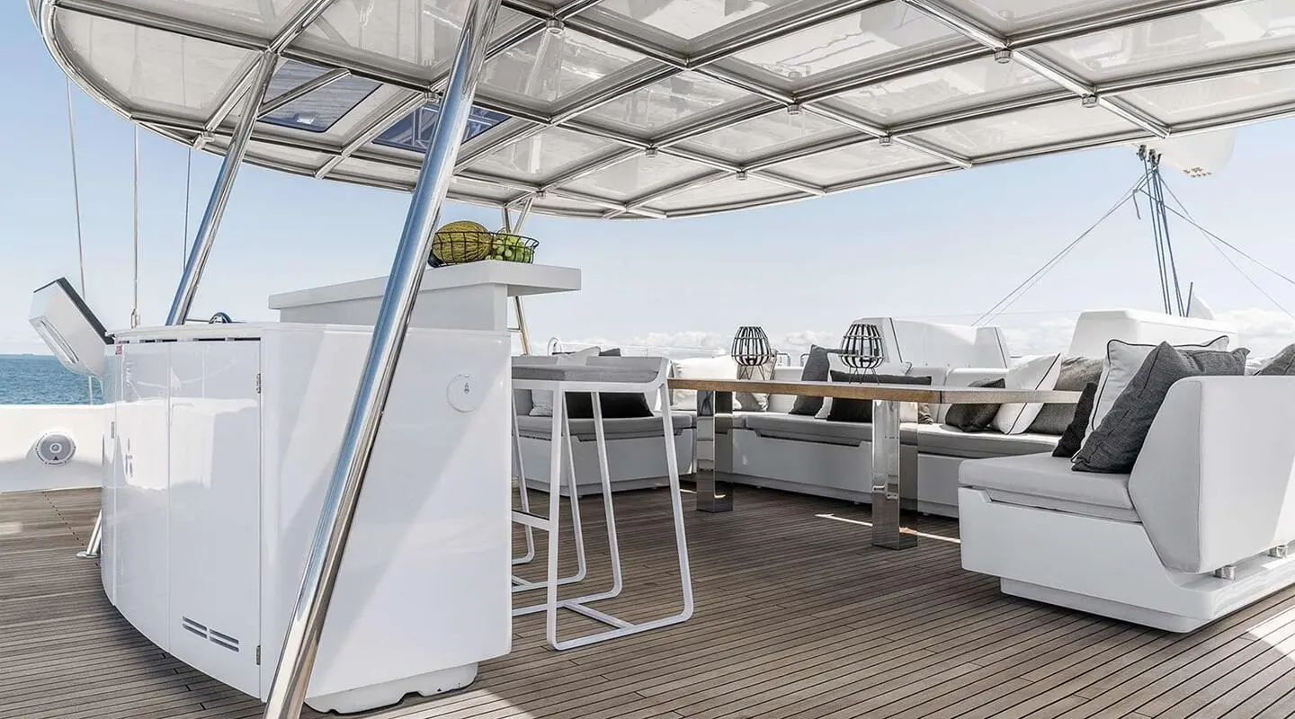 Gulet yacht Above & Beyond deck with shaded seating and white railings
