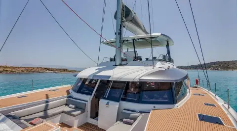 Astoria yacht at dock with open deck stairs and moored lines