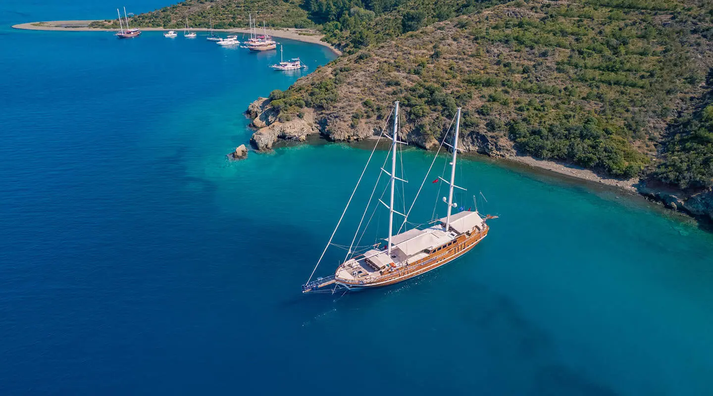 Two-masted luxury gulet Lycian Queen anchored in calm turquoise water