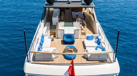 Yacht Morning Star deck viewed from stern with seating, cushions, and blue water