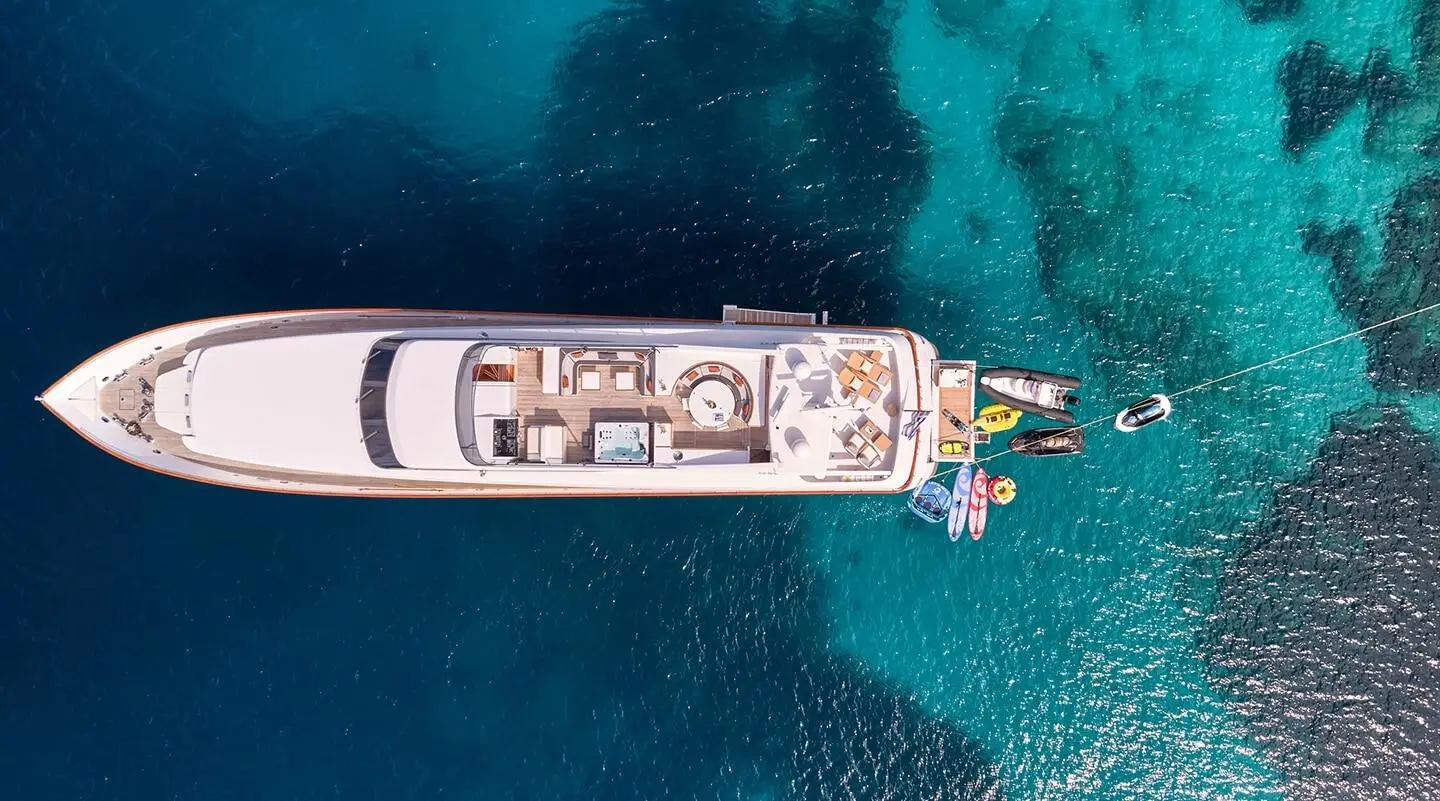 Aerial view of a luxury Mobius yacht anchored in clear blue water