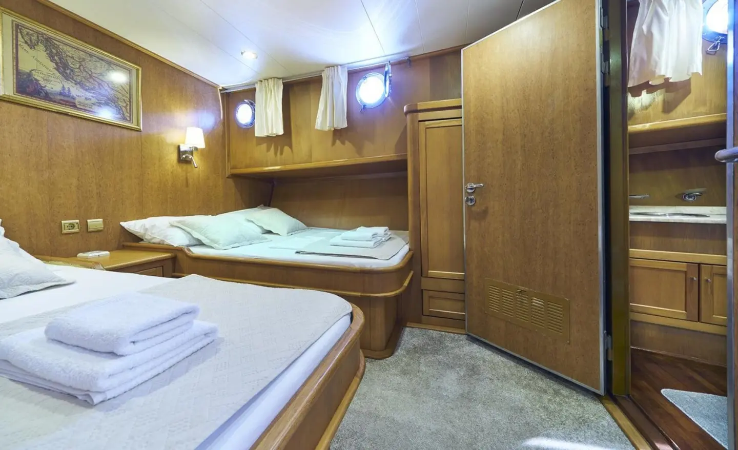 Interior shot of Morning Star gulet with bunk beds and wood cabinets