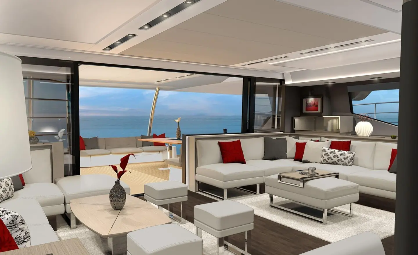 Spacious yacht D2 saloon with white and red seating, large windows, and ocean view