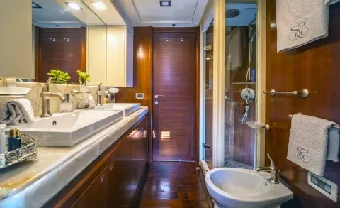 Seventh Sense yacht bathroom and deck area with glossy wooden surfaces