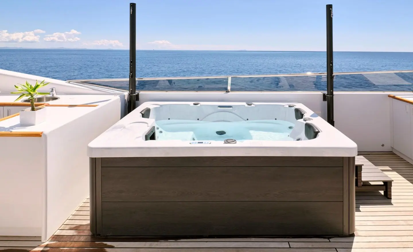 Mobius luxury yacht rooftop hot tub on deck with ocean view