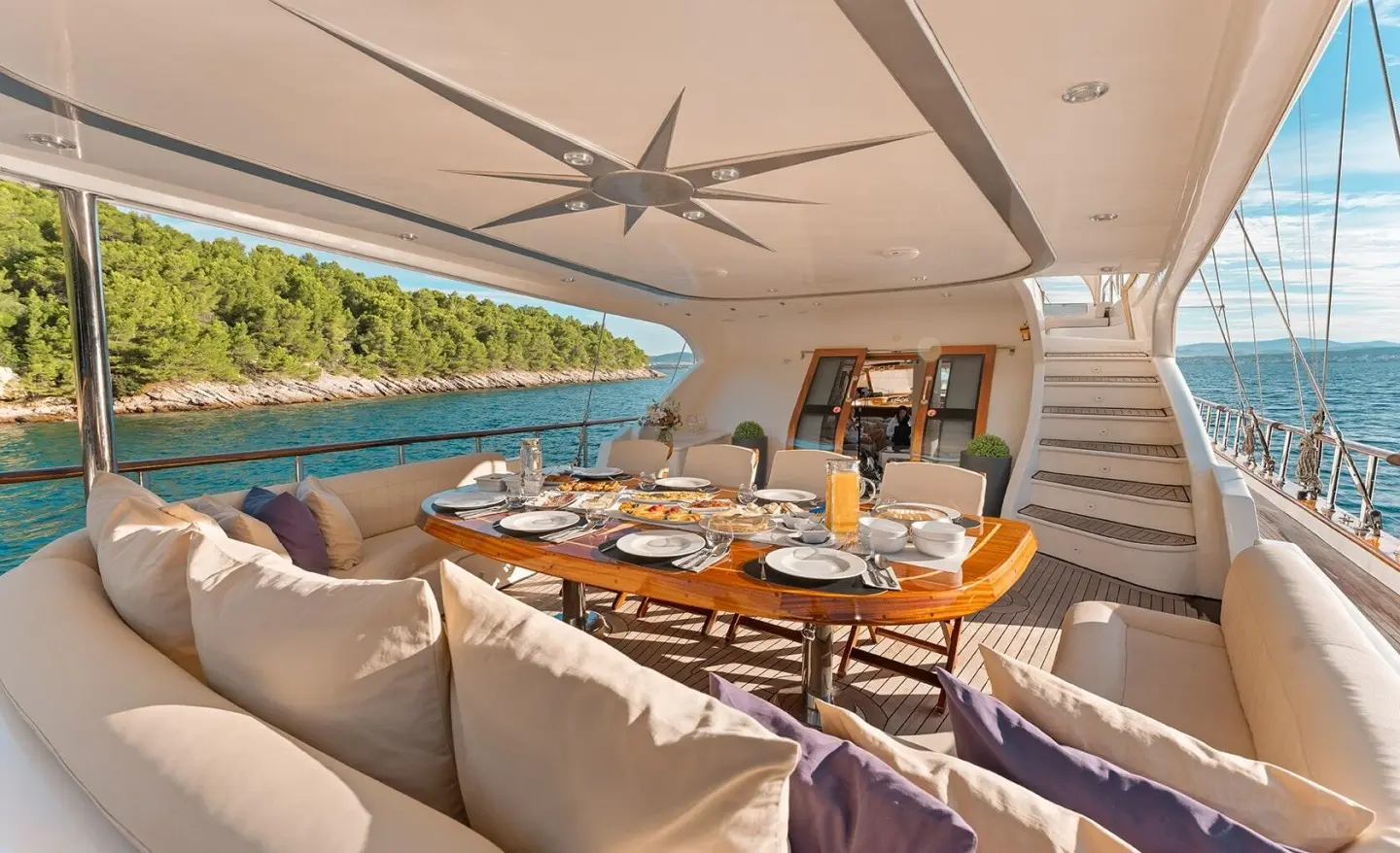 Yacht Alessandro I luxury gulet dining area at sunset on deck
