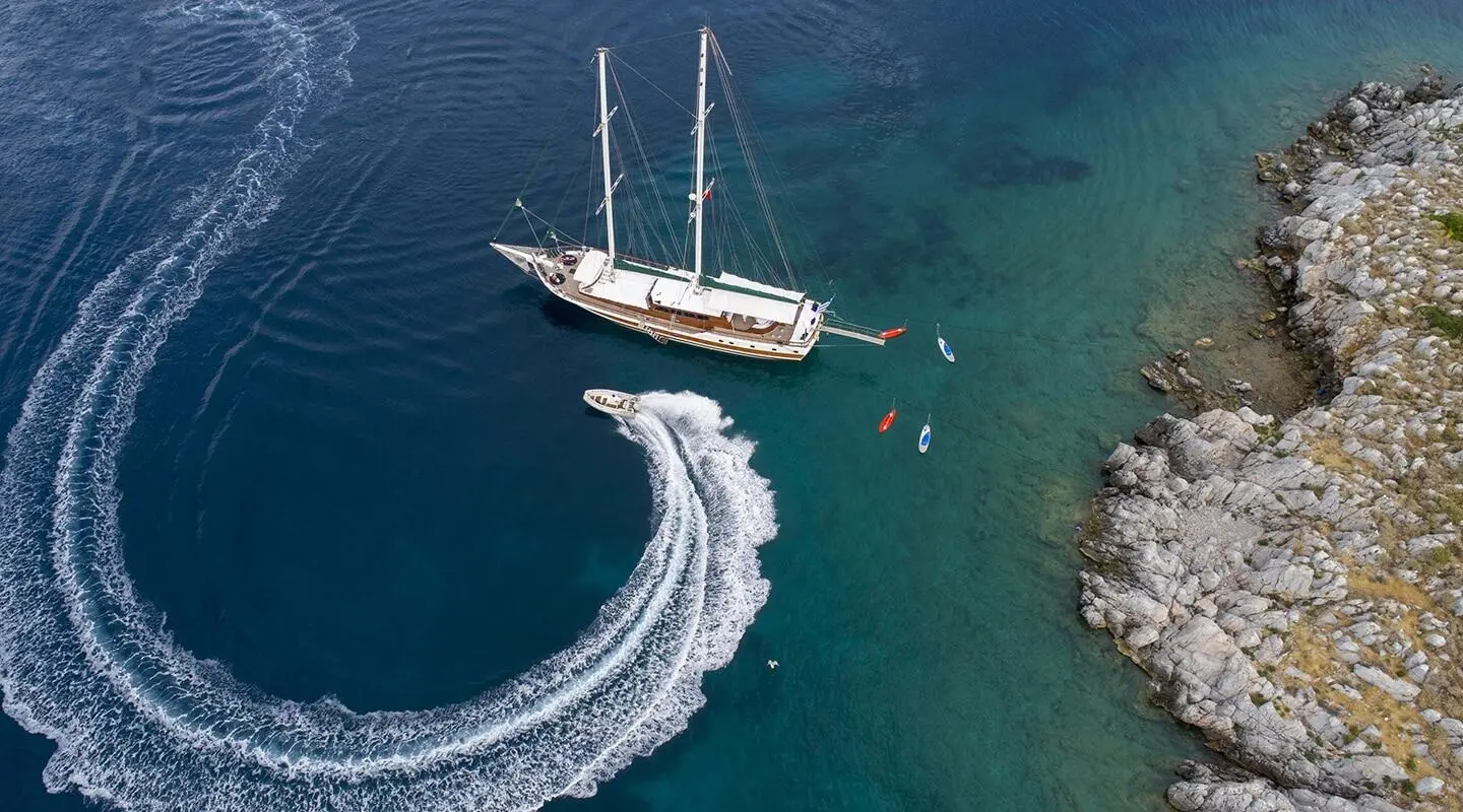 Ecce Navigo luxury gulet sailing at sunset with calm turquoise water