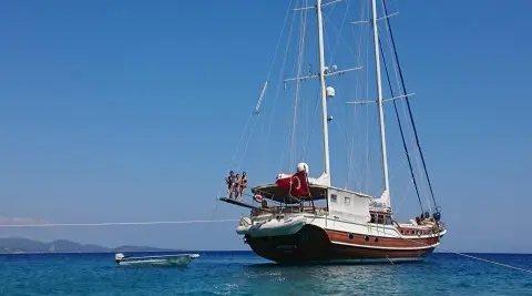 Enderim A yacht anchored in calm blue water during sunset on calm seas