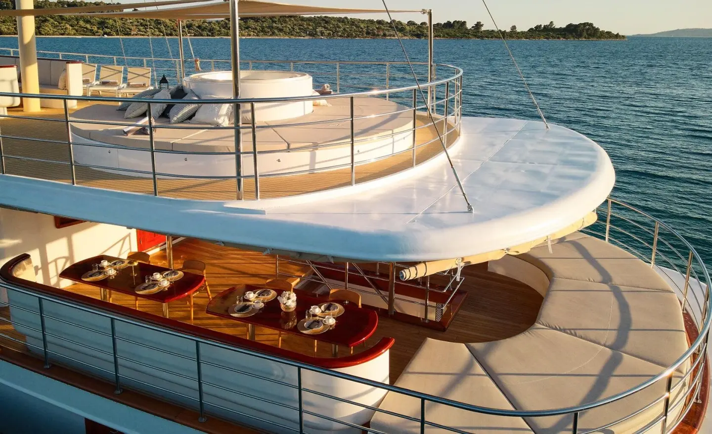 Bellissima Bellezza yacht deck scene with teak, railing, and calm water