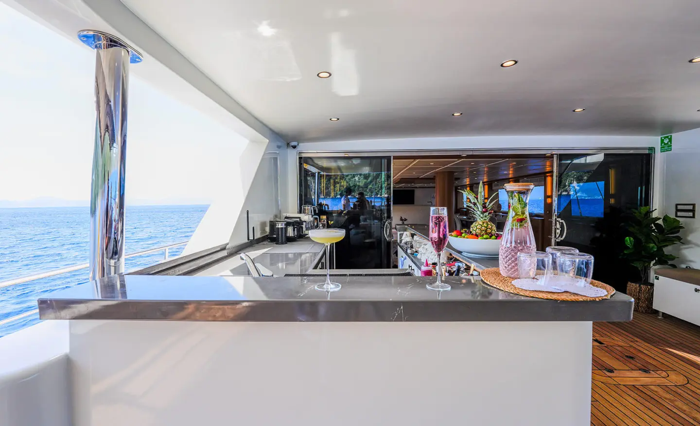 Aft deck bar on King Of The Sea yacht with seating and ocean view behind