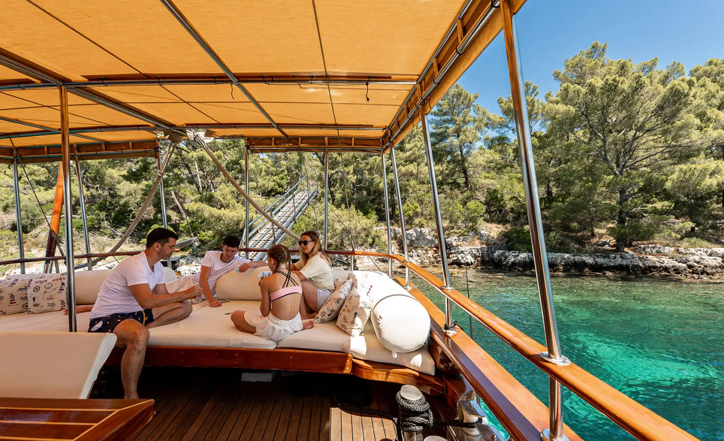 Eleganza yacht aboard a sunlit luxury gulet at sunset, turquoise sea