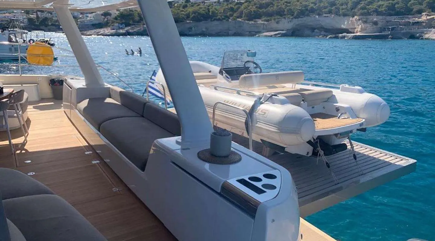 Just Marie 2 yacht deck with seating and tender boat in water view