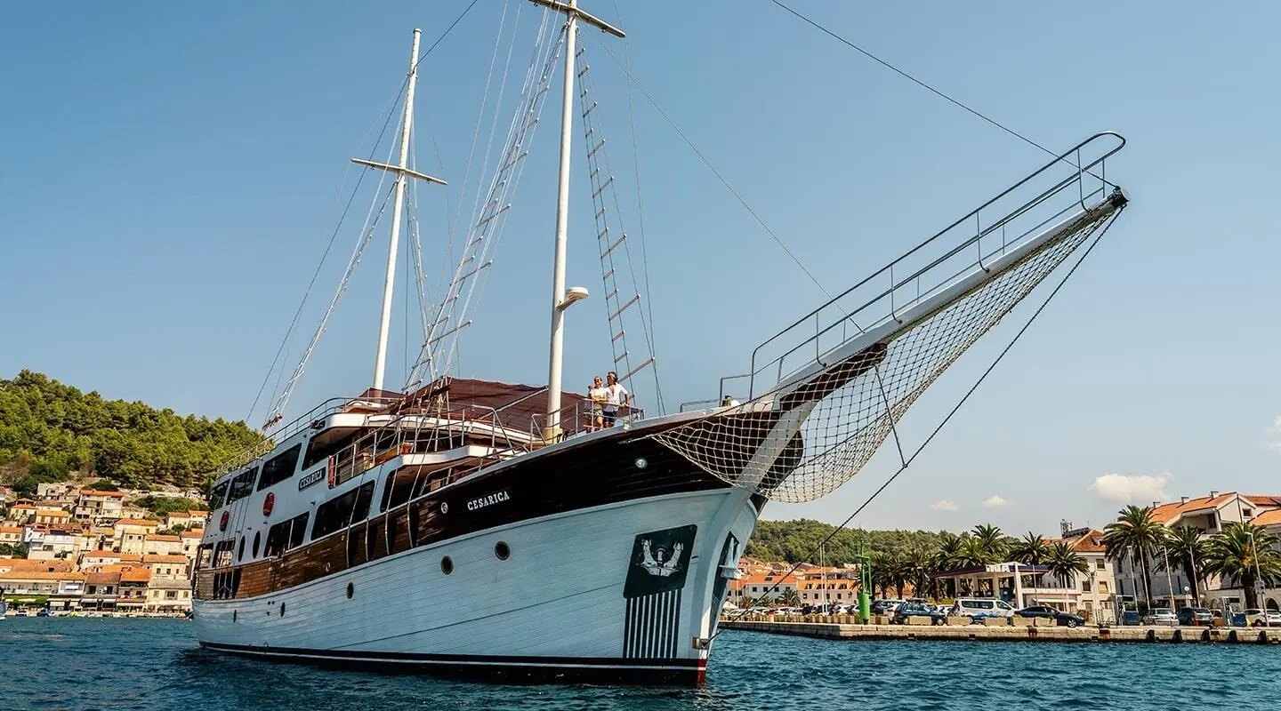 Cesarica luxury gulet anchored with stern to the sea and masts