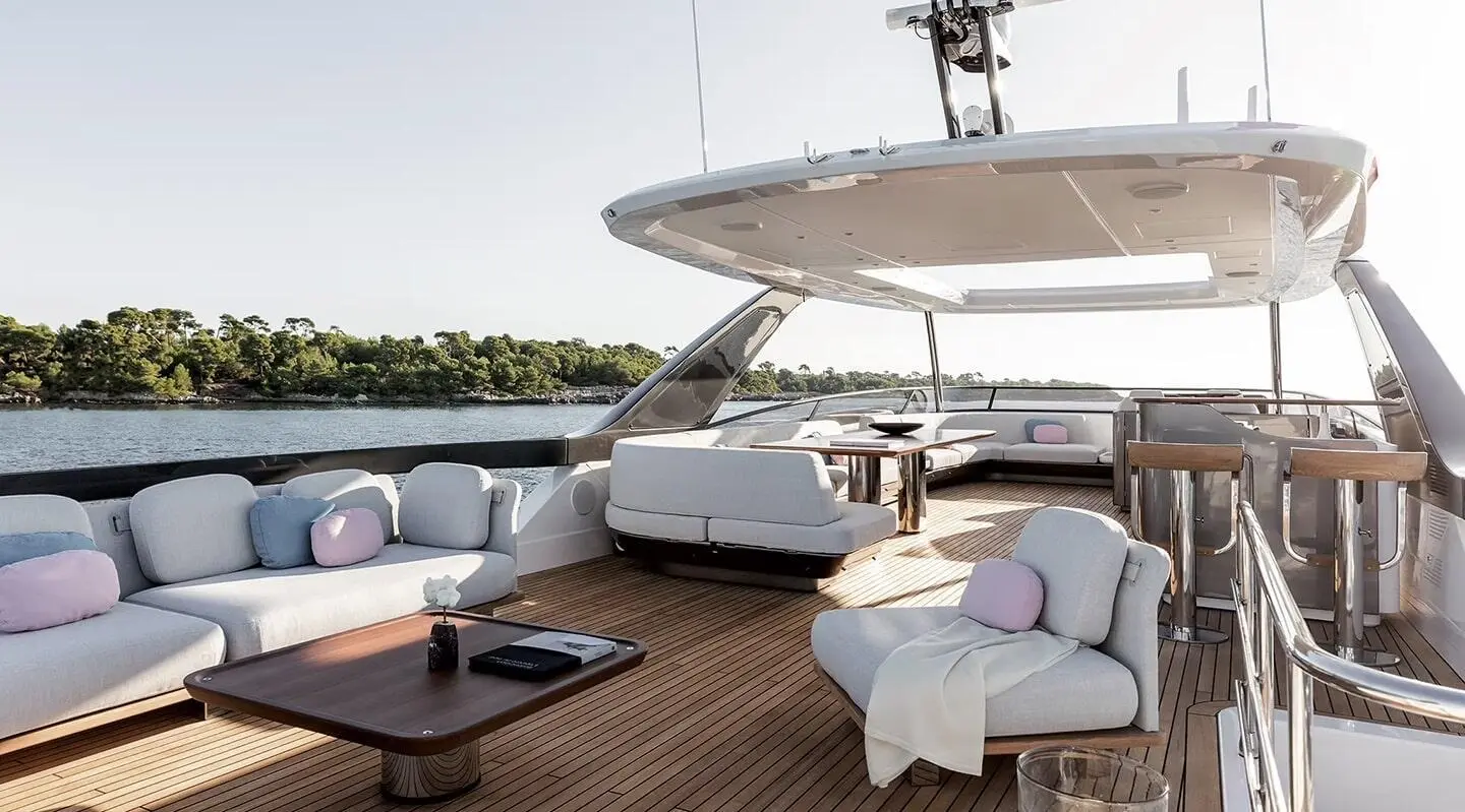 Viva II yacht with open deck seating, dining table, and sea view