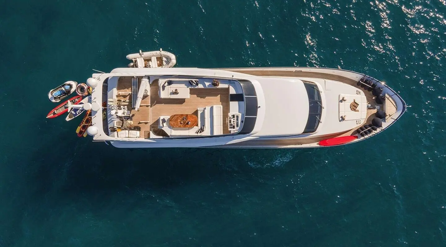 Aerial view of the motor yacht Zoi sailing on blue sea waters