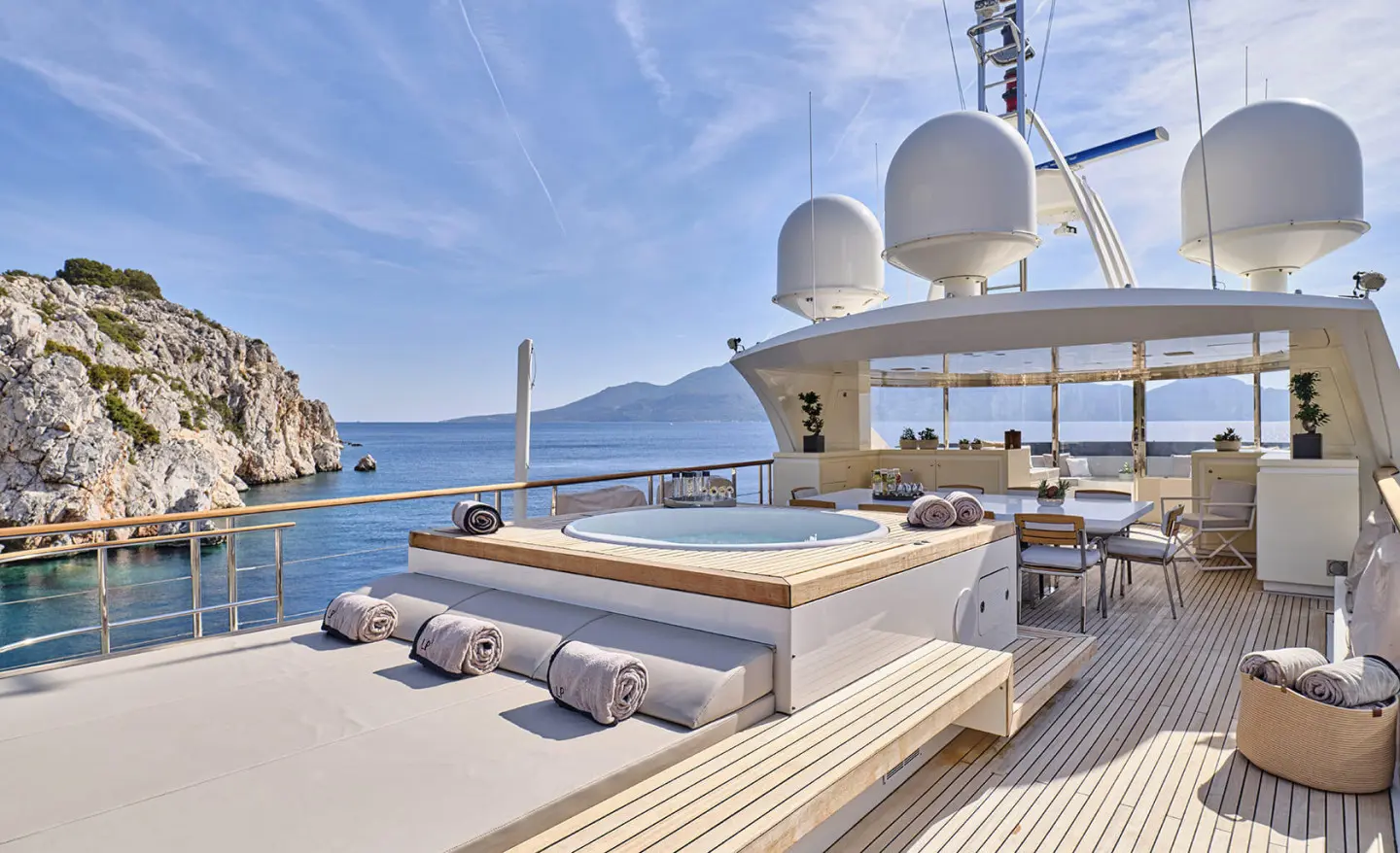 Sun deck on La Pellegrina 1 yacht with loungers and panoramic sea view