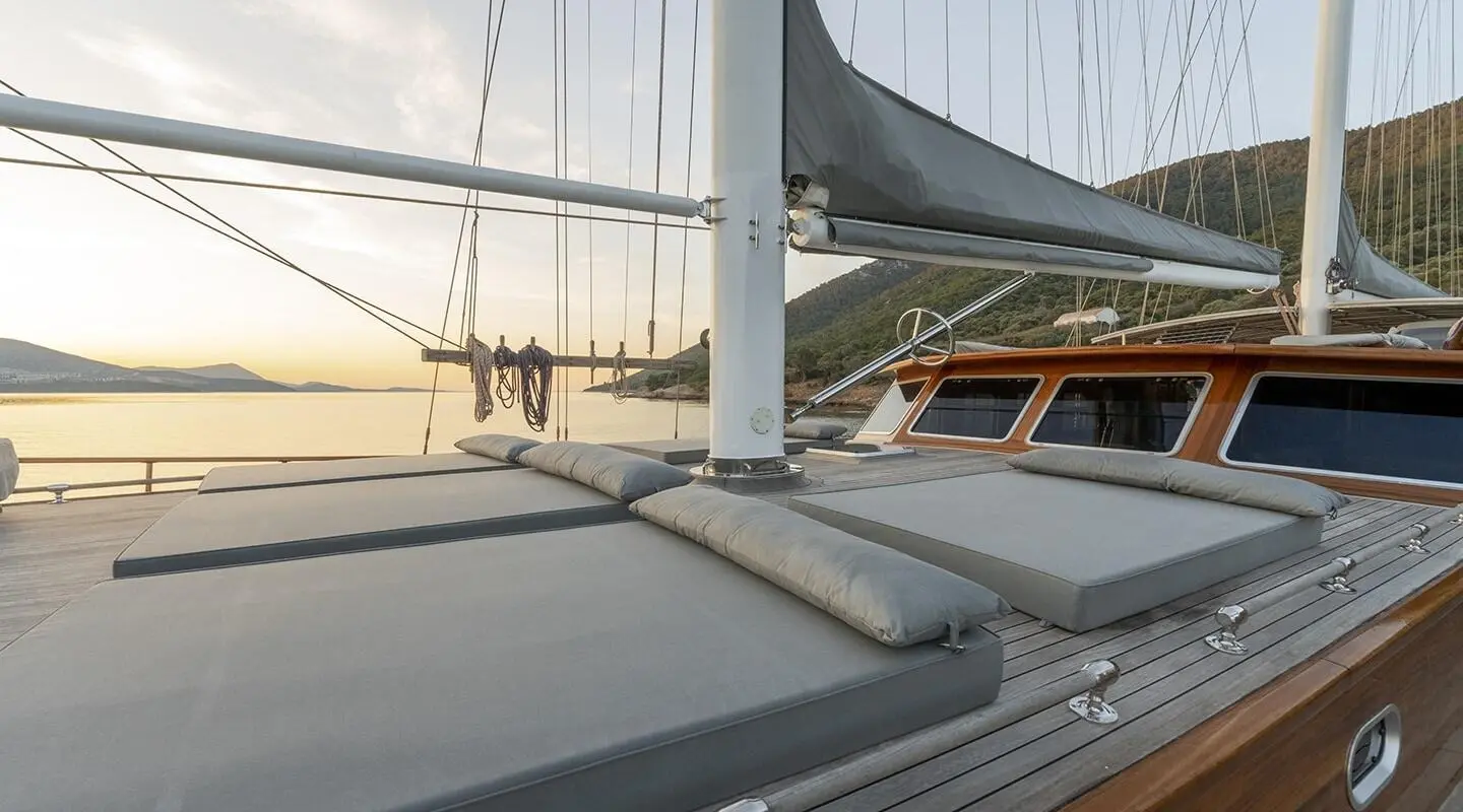 Sunset view from on deck of Bedia Sultan yacht with calm water and rigging