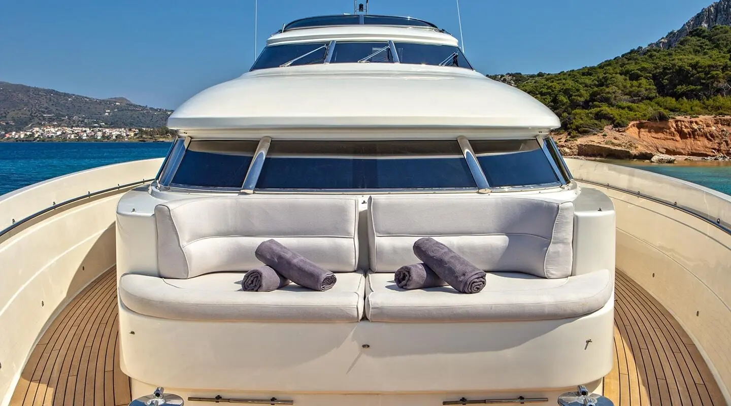 Front view of the Divine yacht bow with seating cushions and windows