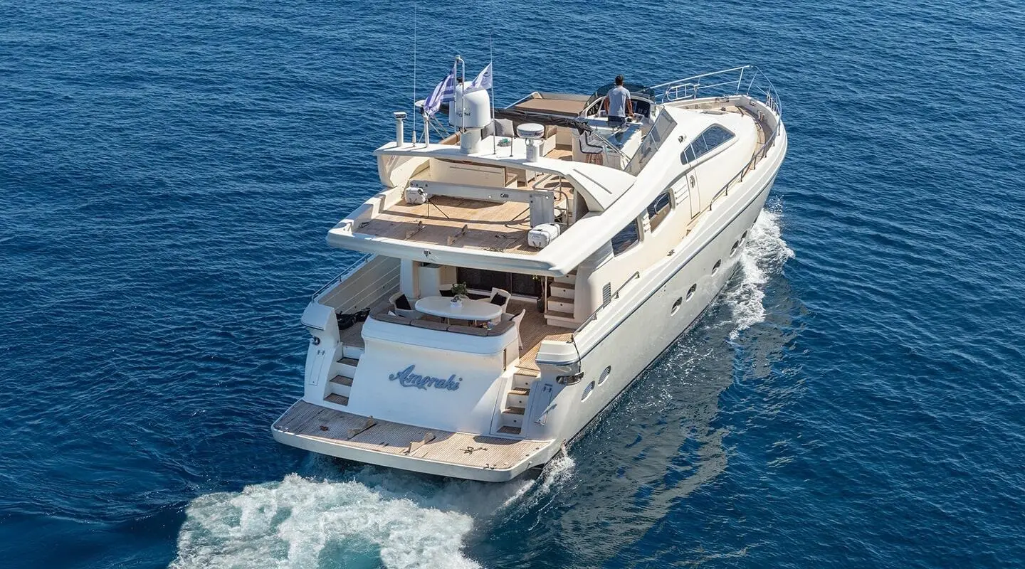 Amoraki yacht at sea with upper deck seating and helm visible