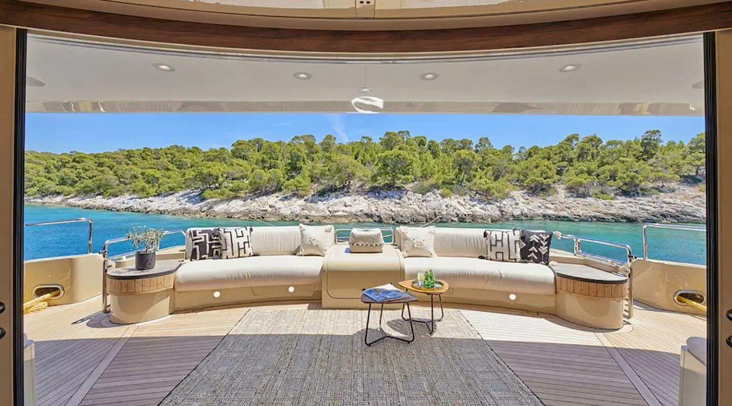 Daloli yacht outdoor cockpit seating with ocean and rocky shoreline