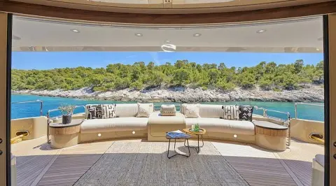 Daloli yacht outdoor cockpit seating with ocean and rocky shoreline