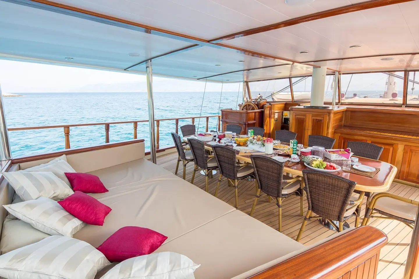 Morning Star luxury gulet deck with seating, sun cushions, and ocean view at sunset