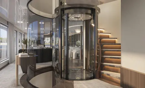 Interior of Bello luxury yacht with glass elevator, wooden stairs, and seating area