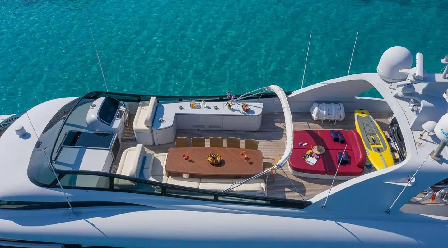 Top-down view of Glaros luxury yacht deck with seating and blue water