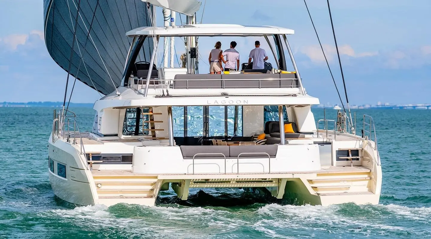Daiquiri yacht rear deck with passengers on a luxury motor yacht at sea