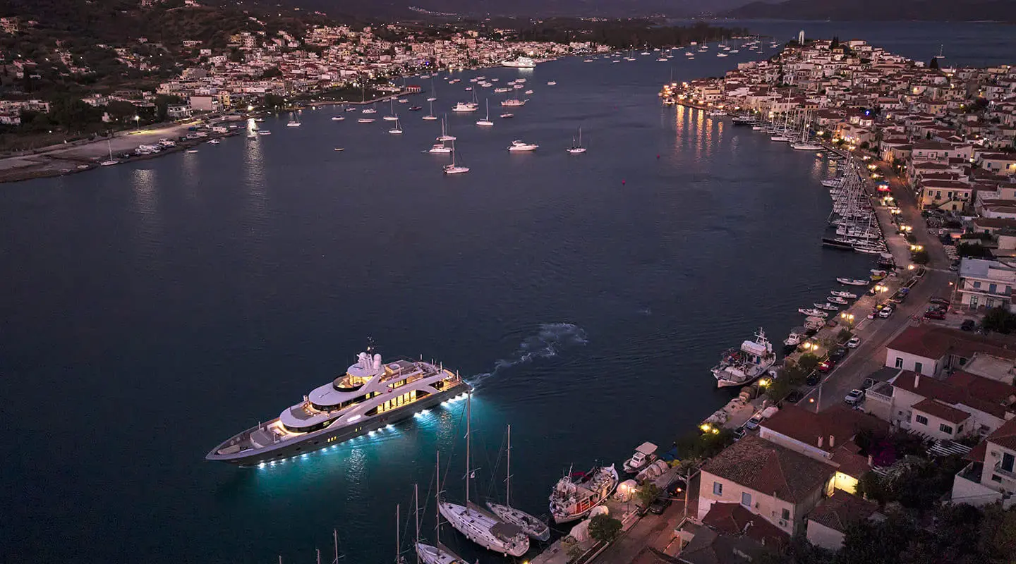 La Pellegrina 1 yacht docked in a harbor at dusk, calm water reflections