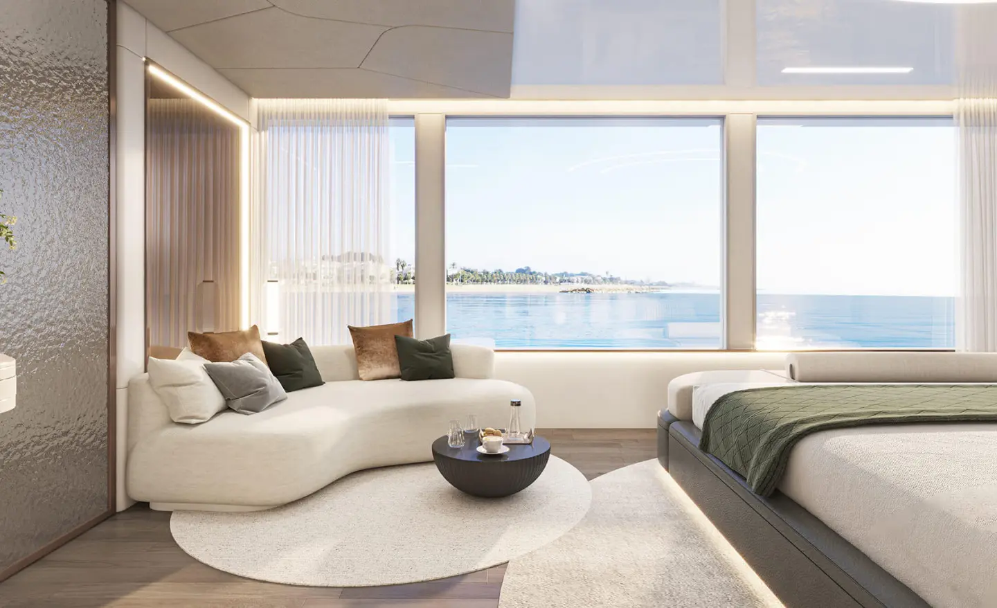 Interior view of a bright yacht with white seating and large windows overlooking the sea