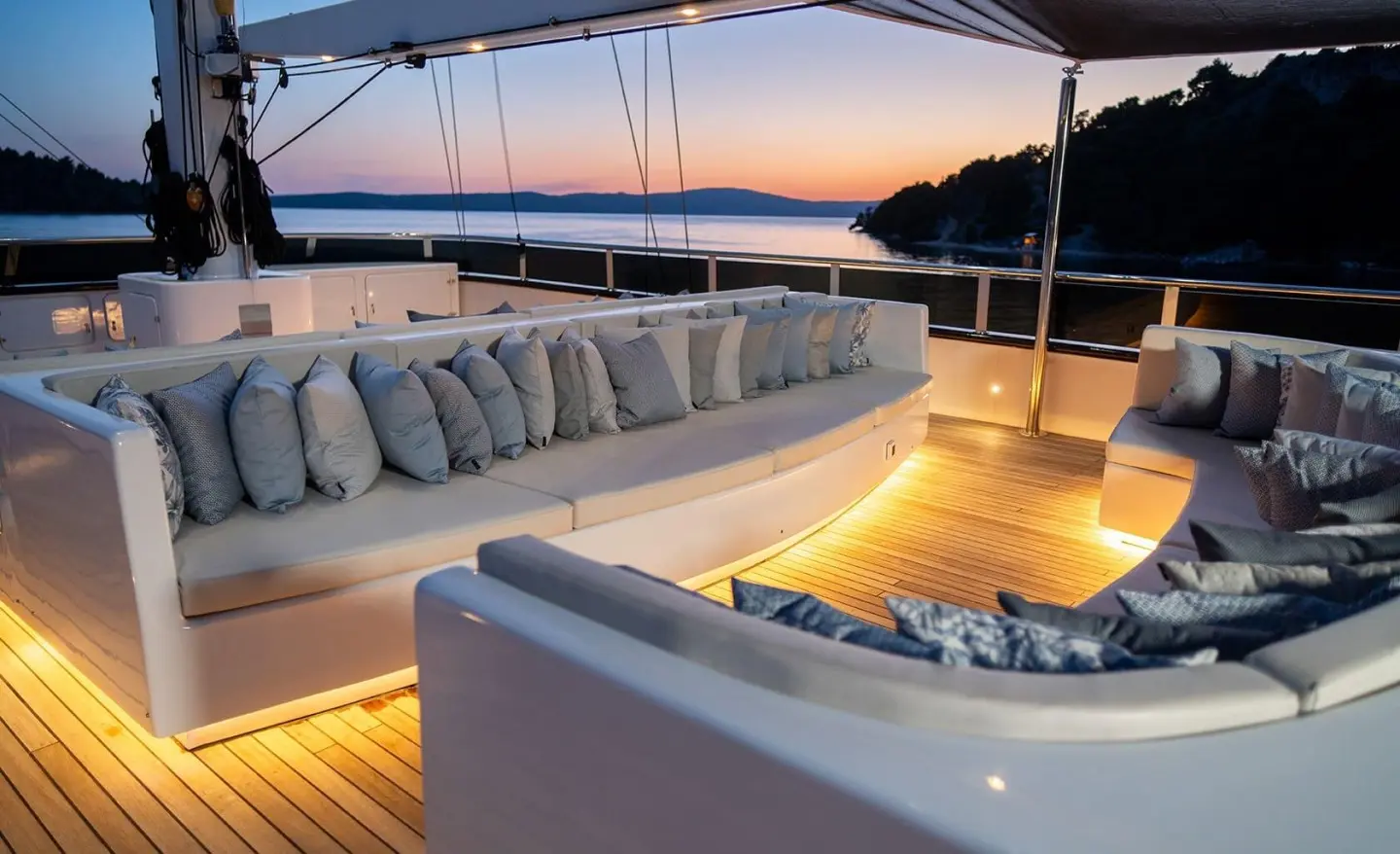 Anima Maris yacht on sunset deck with seating and warm lighting