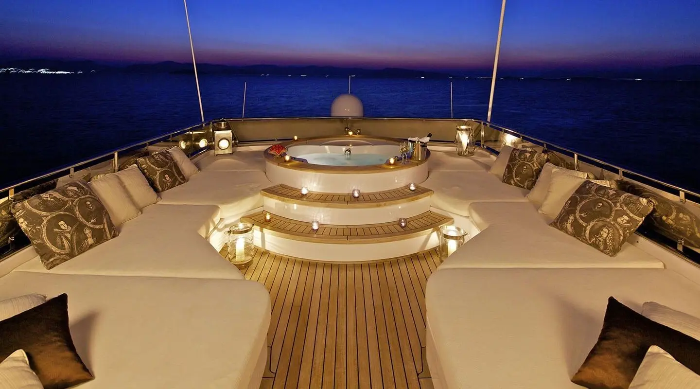 O'Rion yacht deck at sunset with illuminated seating and wide stern lounge