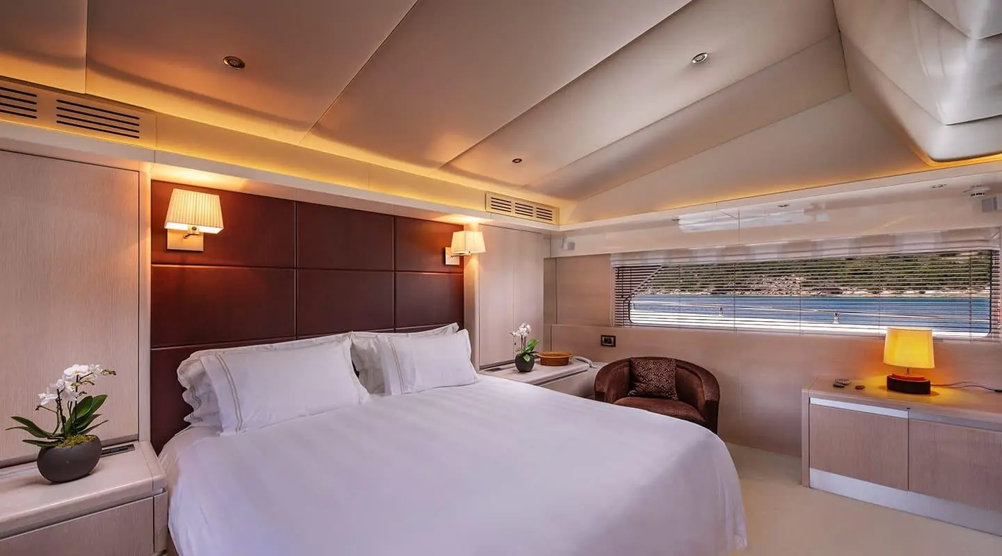 Luxurious Master Cabin on Magix yacht with two large beds and wood paneling