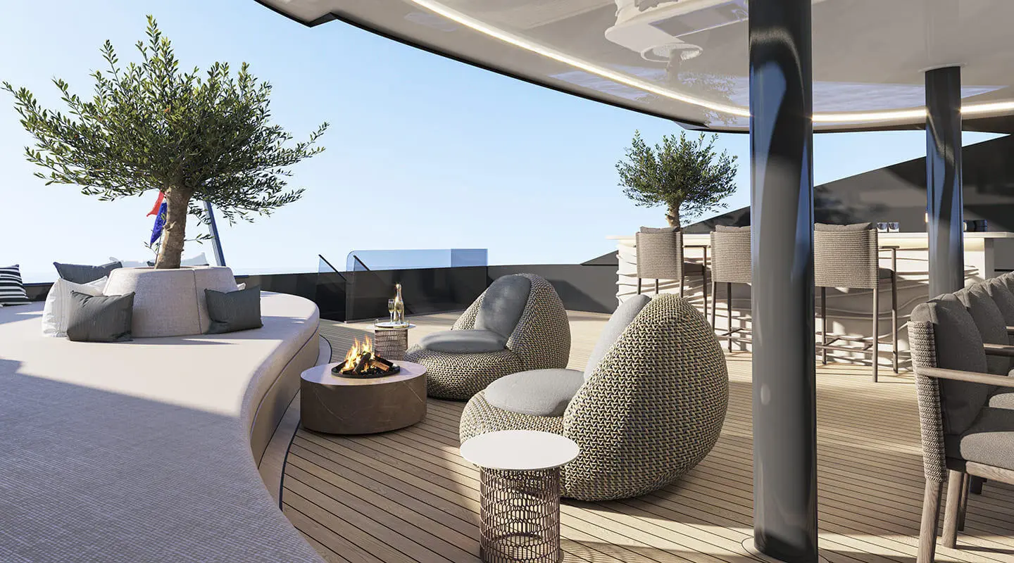 Yacht Bello sun deck with woven rattan seating, cushions, and a view