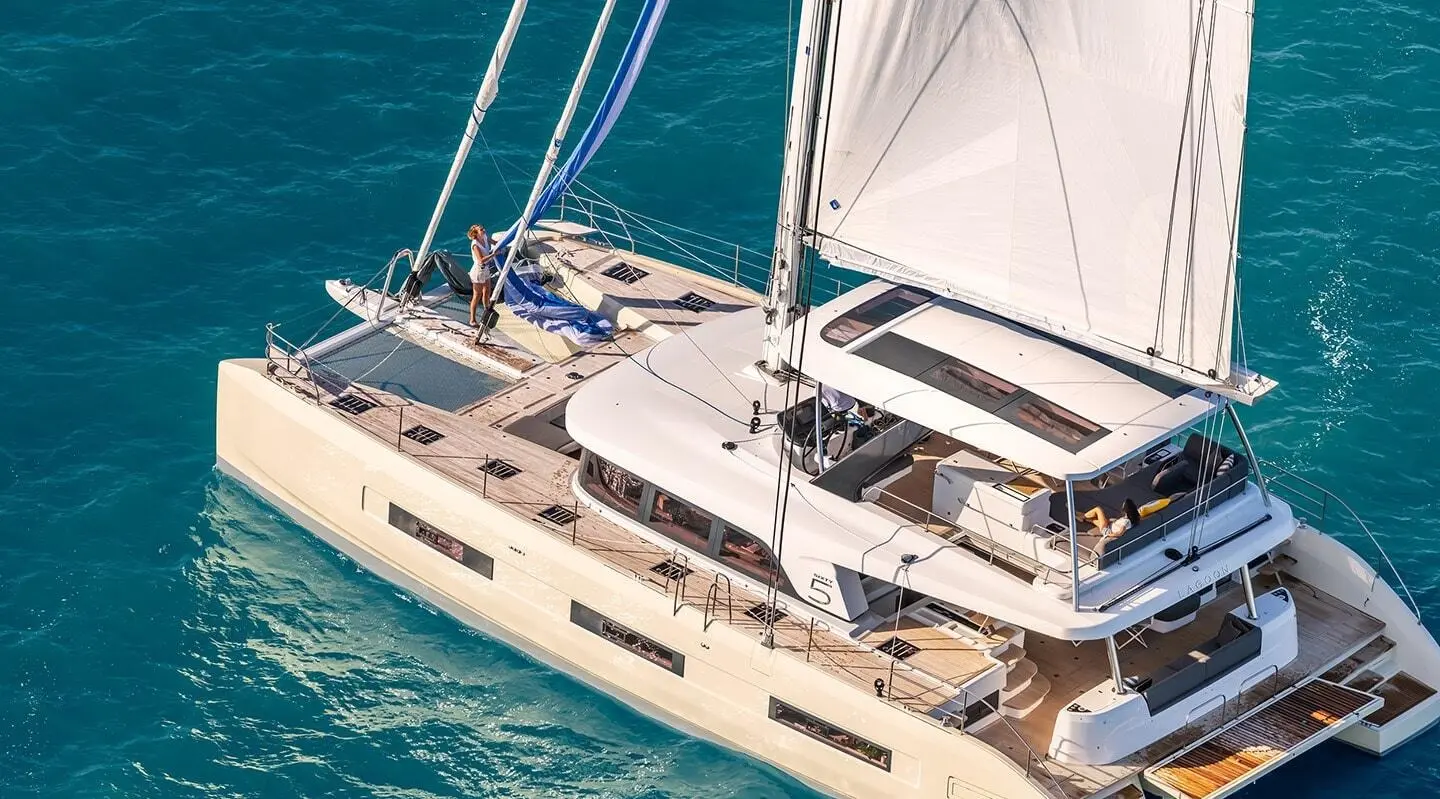 Daiquiri luxury sailing yacht anchored with deck seating and sails visible
