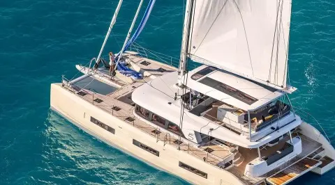 Daiquiri luxury sailing yacht anchored with deck seating and sails visible