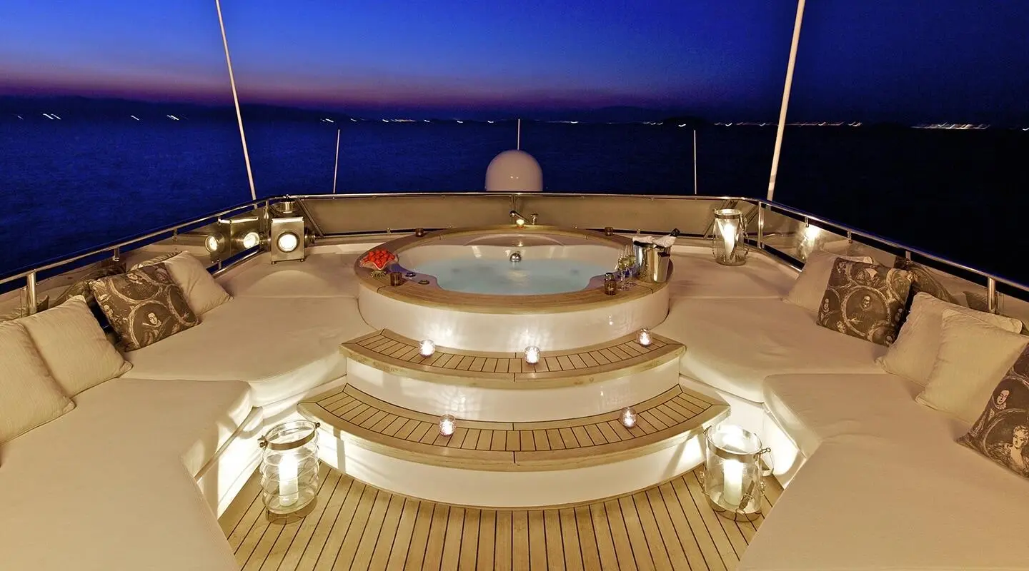 O'Rion yacht deck with circular jacuzzi and sunset skyline view
