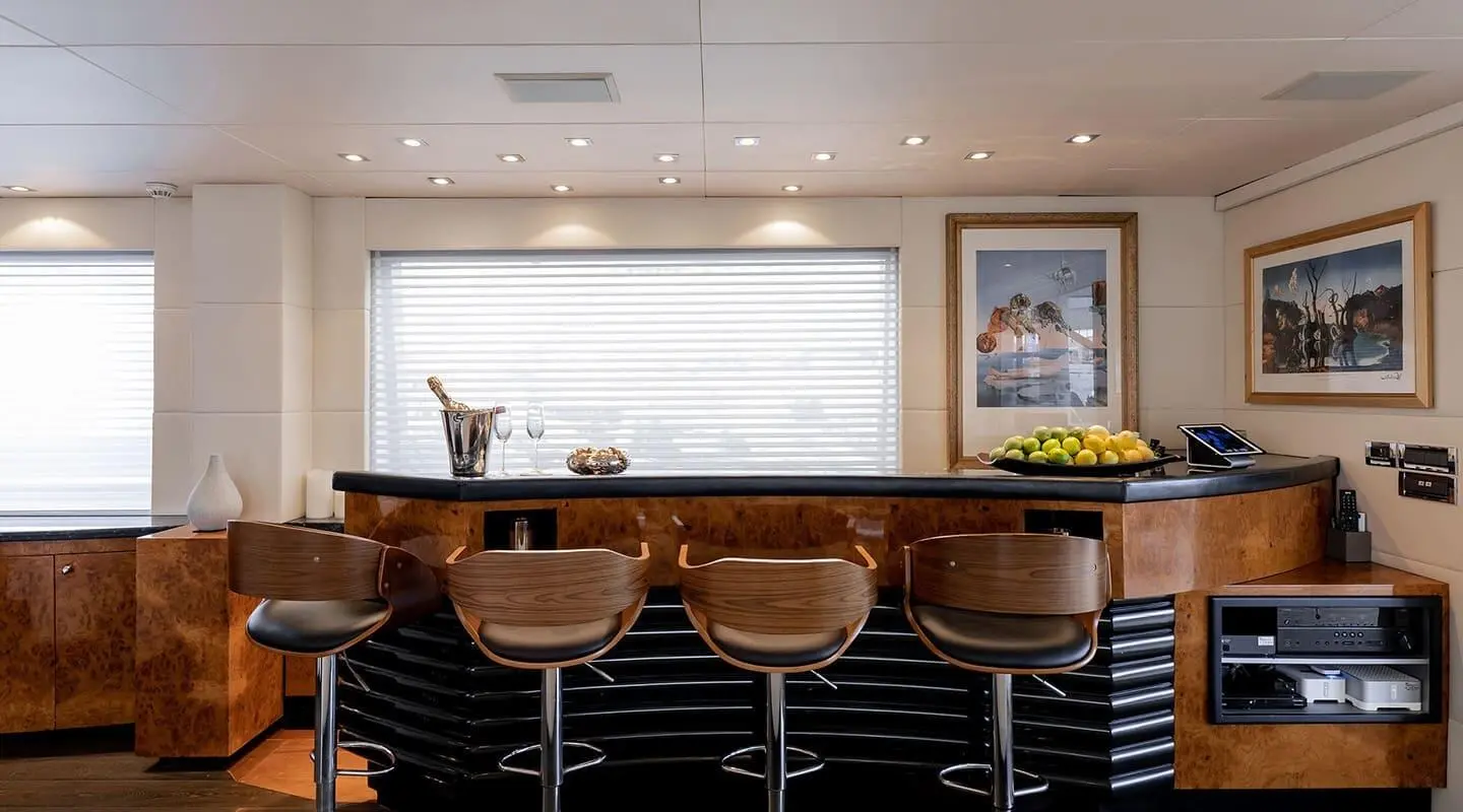 Brooklyn yacht bar deck with brown leather stools and bright lighting